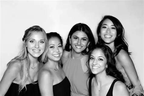 Black and white photo booth image of friends