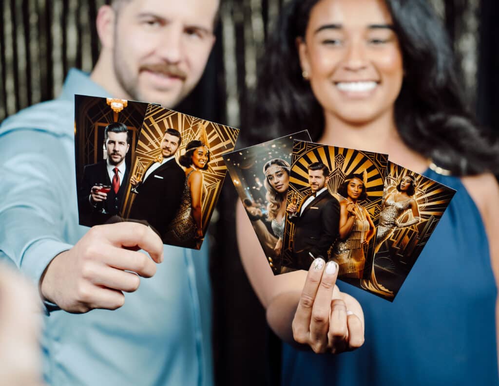 Man and woman smiling holding up glamorous AI photo booth prints 
